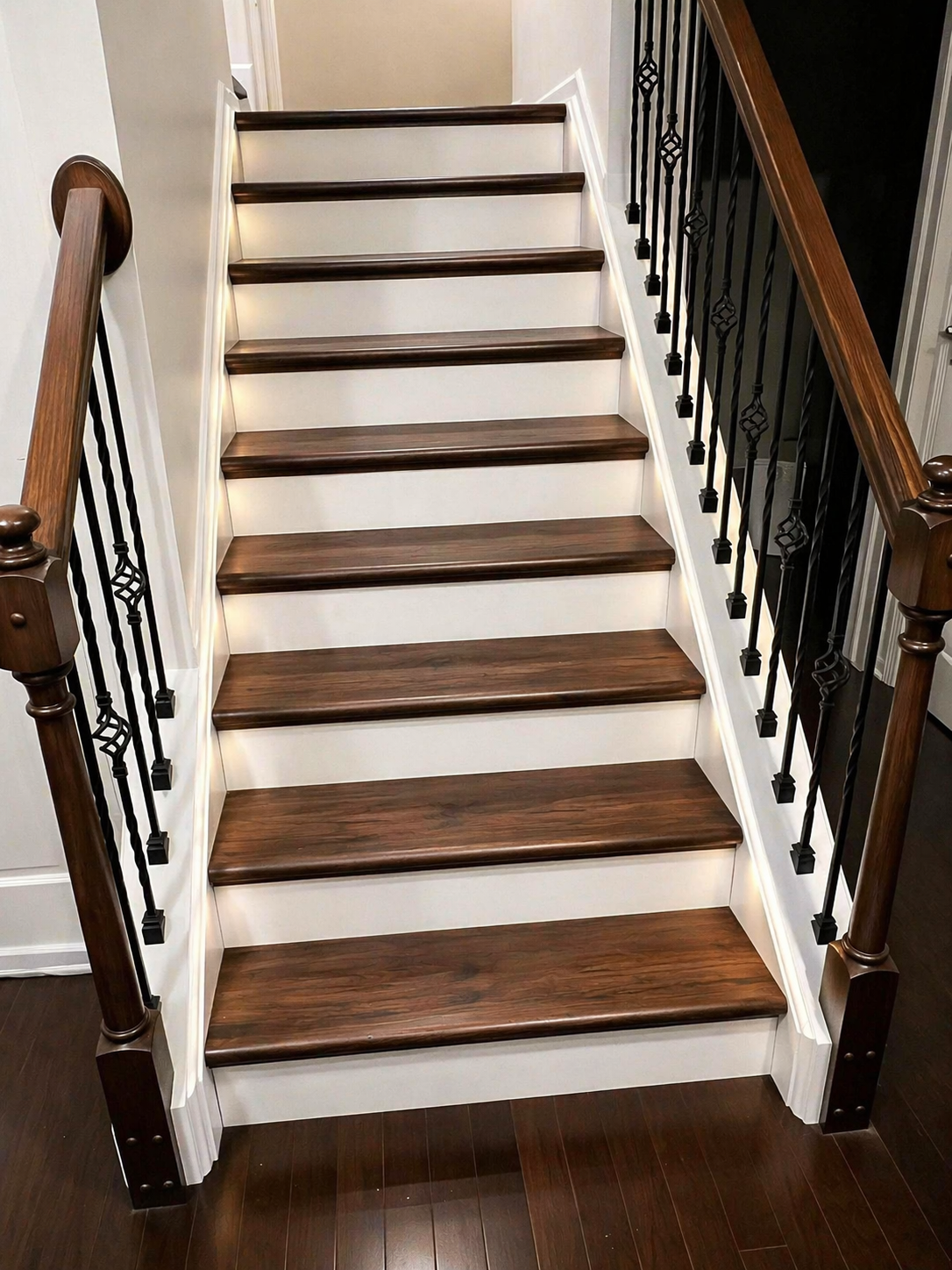 Dark oak vinyl stair treads with white risers and black balusters
